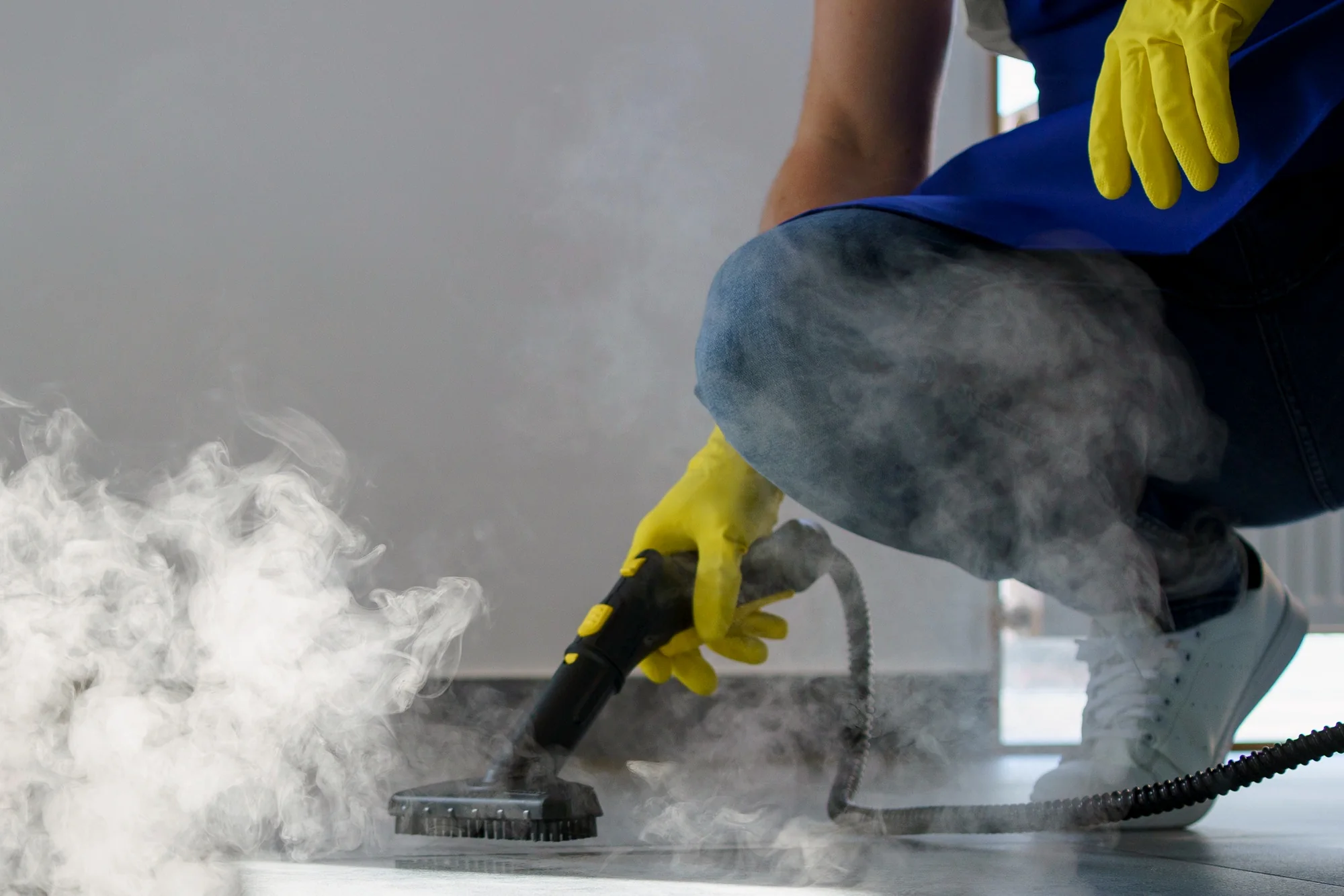 Professional steam cleaning a surface